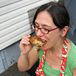 Zora samples a piece of chicken on the way to the table. Quality control, honest